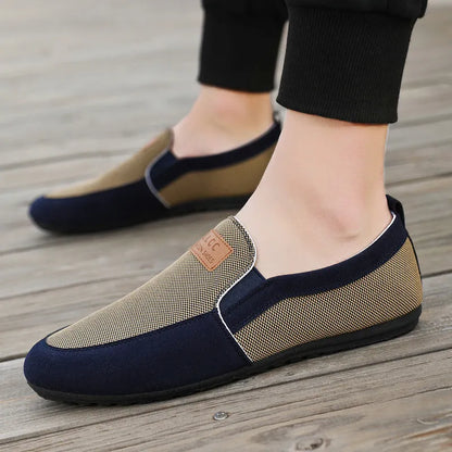 Men's grey canvas lace-up casual shoes with a round toe and rubber sole.