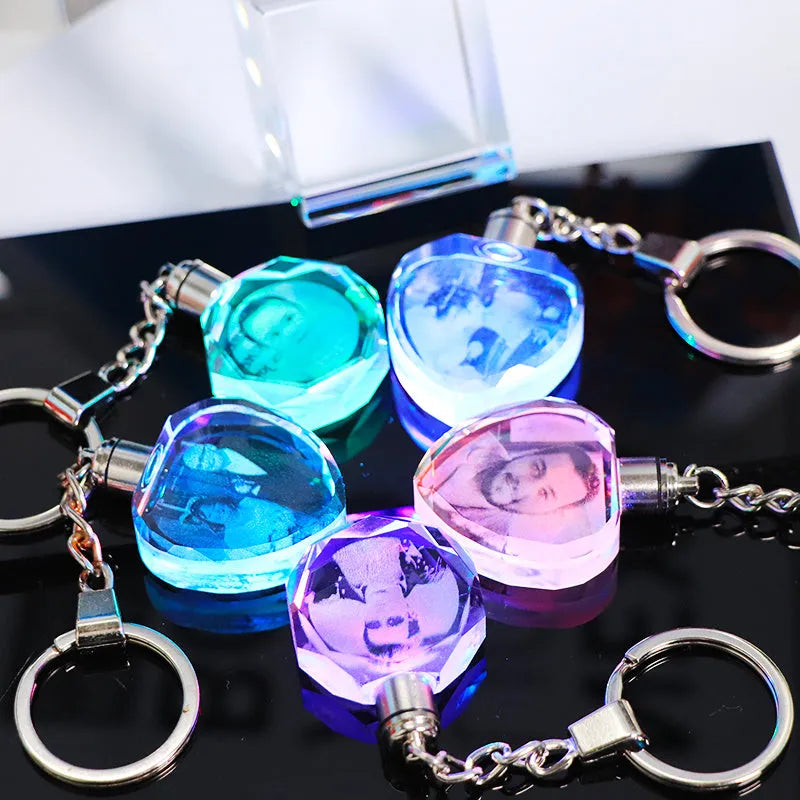 Custom laser-etched crystal photo keychain with internal colourful LED light activated, showing a personalised image.