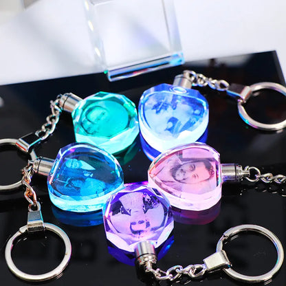 Custom laser-etched crystal photo keychain with internal colourful LED light activated, showing a personalised image.
