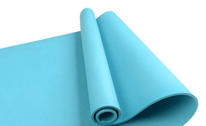 EVA composite fitness and yoga mat in blue, showing its texture and rolled edge next to a storage bag.
