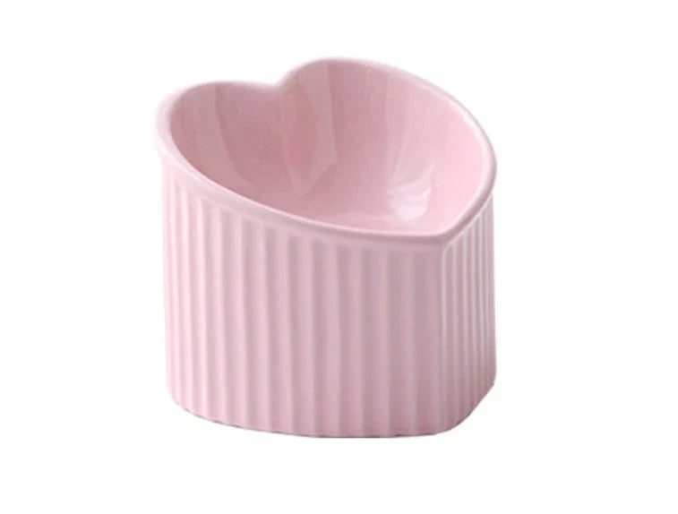 Elevated ceramic pet bowl with tilted design for comfortable and healthy feeding