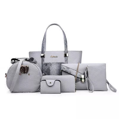 Women's shoulder bag with zipper closure and multiple pockets in light grey, black, off-white, and rose red