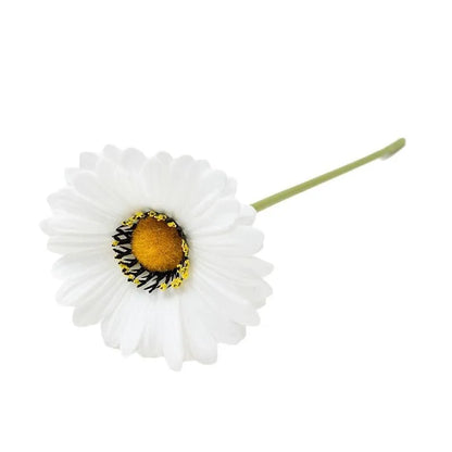 Silk artificial flower bouquet in a white polyurethane pot on a wooden table.