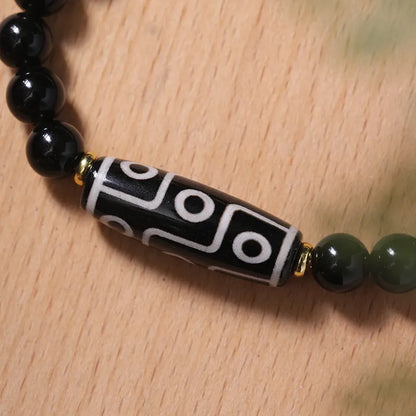Obsidian-coloured agate Tibet dzi bead bracelet with traditional ethnic design