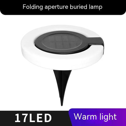 Solar-powered waterproof underground garden light showing its low-profile design and solar panel.