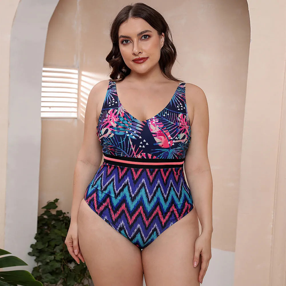 Blue and white printed women's one-piece swimsuit with spaghetti straps and a striped vest design.