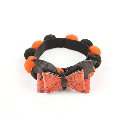 Halloween pet collar with fur ball decoration in pumpkin design