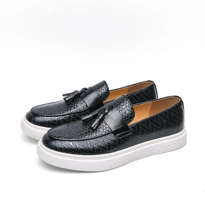 Men's black casual leather shoes with fringe detailing on round toe and low heel