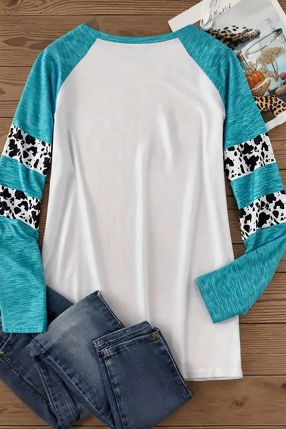 Sky blue long sleeve t-shirt with a large 3D printed Halloween pumpkin design on the front.