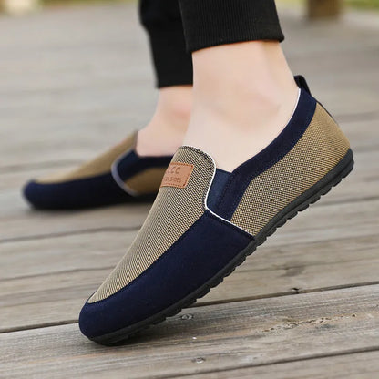 Men's grey canvas lace-up casual shoes with a round toe and rubber sole.