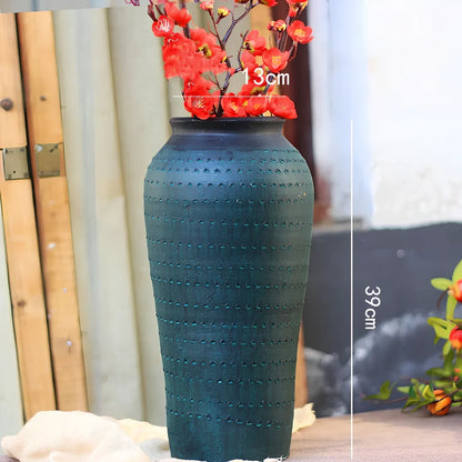 Ceramic mosaic vase with dried flower arrangement, handcrafted surface detailing