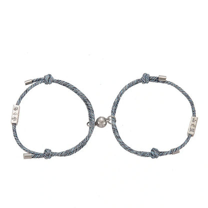 Magnetic couple's bracelet with geometric design and meaningful charms inspired by ancient Chinese tradition