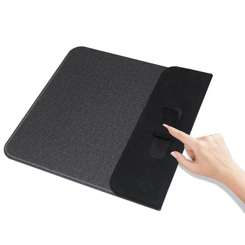 Foldable cloth phone holder unfolded on a table, wirelessly charging a smartphone with 10W power