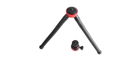 Black octopus tripod with flexible rubber legs wrapped around a pole, holding a smartphone.