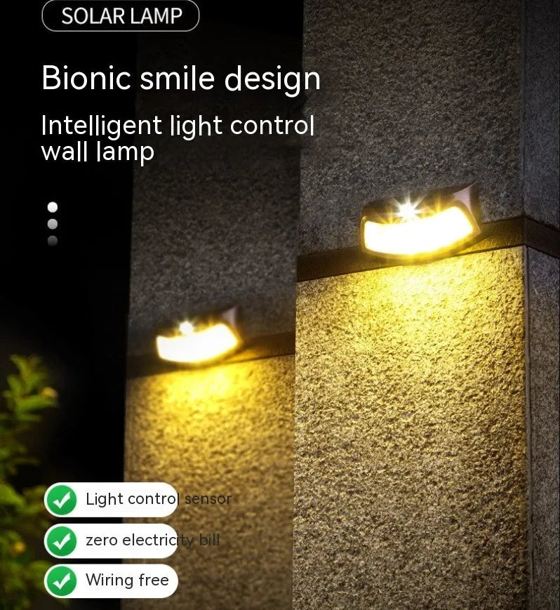Solar outdoor wall lamp with smiling face design, dimensions 153mm by 76mm by 38mm