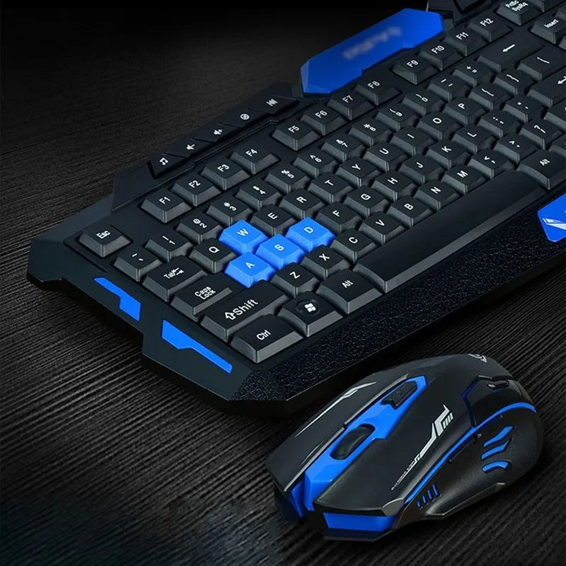 Blue and black wireless keyboard and mouse set on a desk.