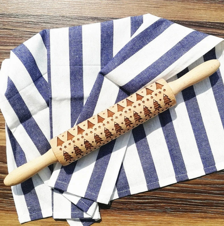 Festive rolling pin with embossed Christmas designs for easy imprinting on dough