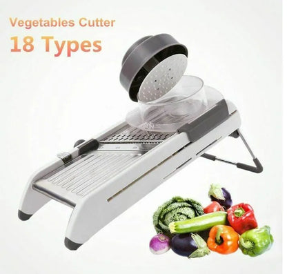 White kitchen vegetable slicer with stainless steel blades and adjustable thickness settings