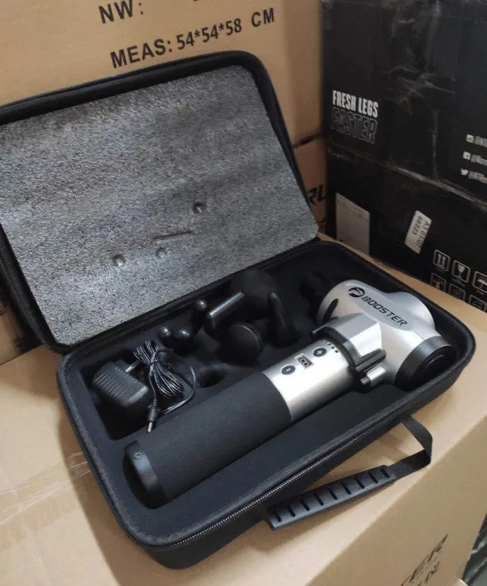 Black and white handheld percussion massage gun on a grey background, showing ergonomic grip.