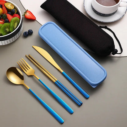 Gold and black stainless steel knife fork spoon set inside a grey mesh carrying bag.