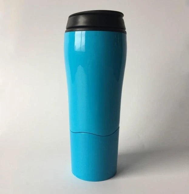 Spill-proof suction cup travel mug with sleek design and carrying strap for convenient on-the-go use