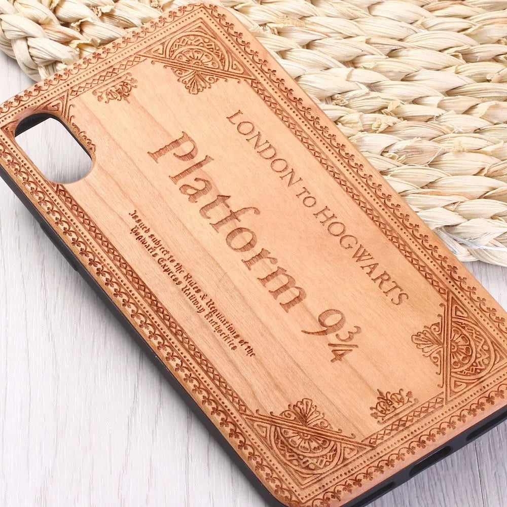 Wooden iPhone case with laser-carved floral design and flexible TPU bumper in natural wood finish.