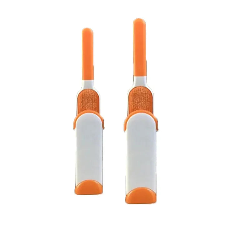 Blue reusable pet hair removal brush with double-sided head next to its self-cleaning base.