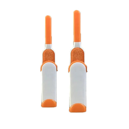 Blue reusable pet hair removal brush with double-sided head next to its self-cleaning base.