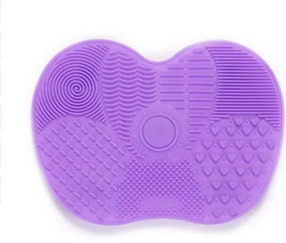 Silicone makeup brush cleaning pad, 15.5 x 12 cm, shown as a coloured brush cleaner mat for cleansing makeup brushes.
