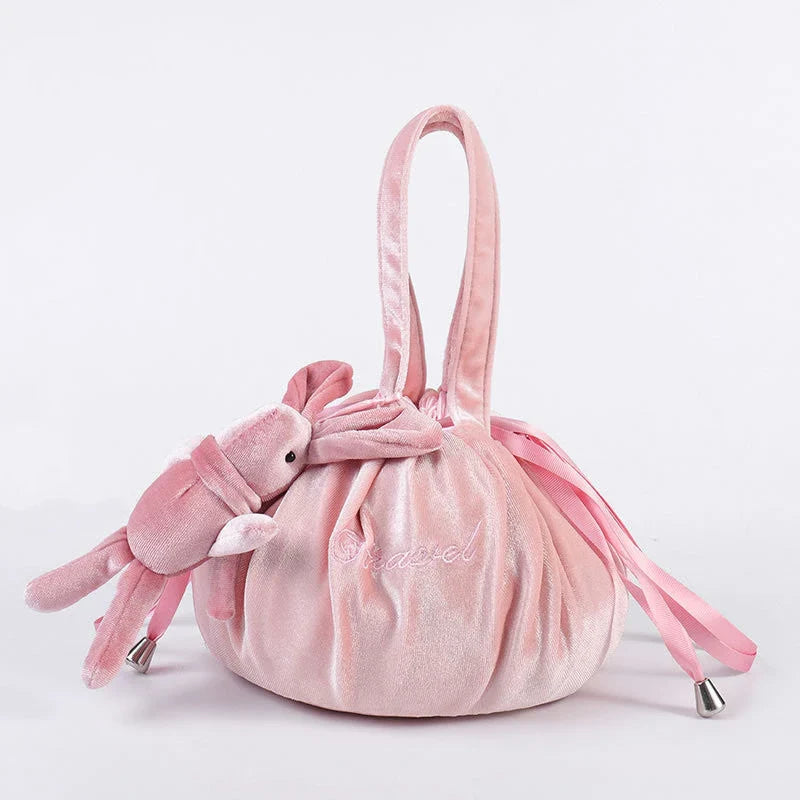 Adorable rabbit ear velvet cosmetic bags in various colors for storing and organizing makeup, toiletries, and other beauty essentials.