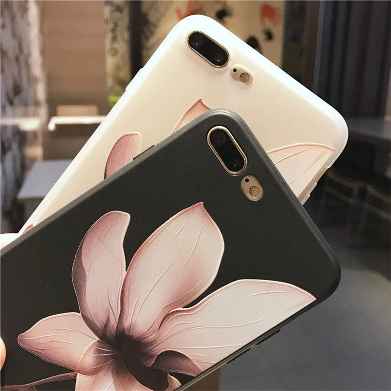 Embossed floral TPU phone case in black and white colour options showing floral pattern detail.