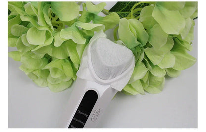 Electric Ultrasonic Facial Beauty Device in white, compact and USB-powered for skincare