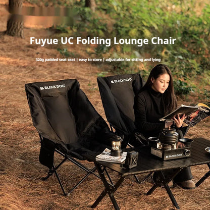 Night black folding camping recliner with Oxford cloth seat and moon chair style, shown in an outdoor setting.