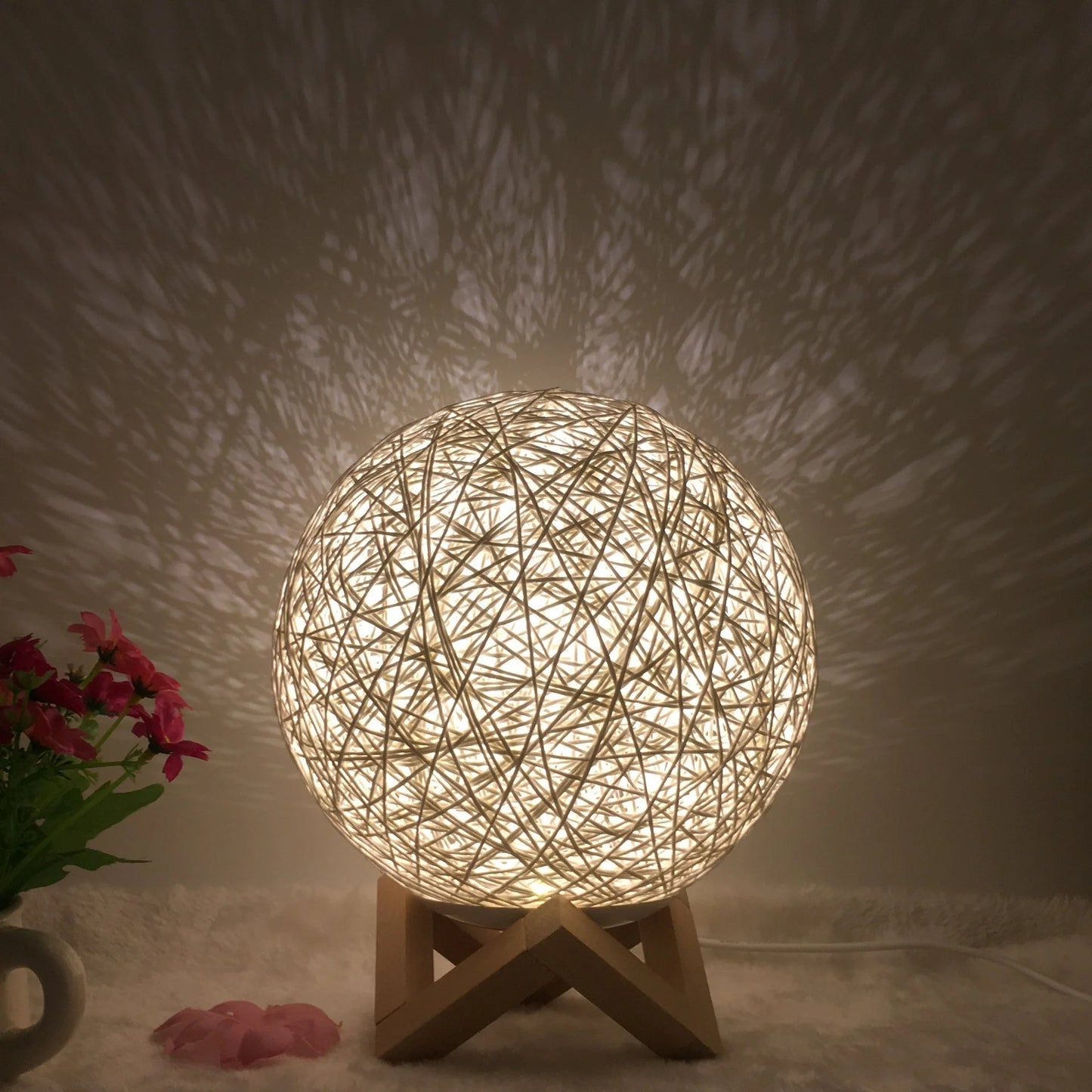 LED rattan table lamp with hand-knit linen shade in various colours