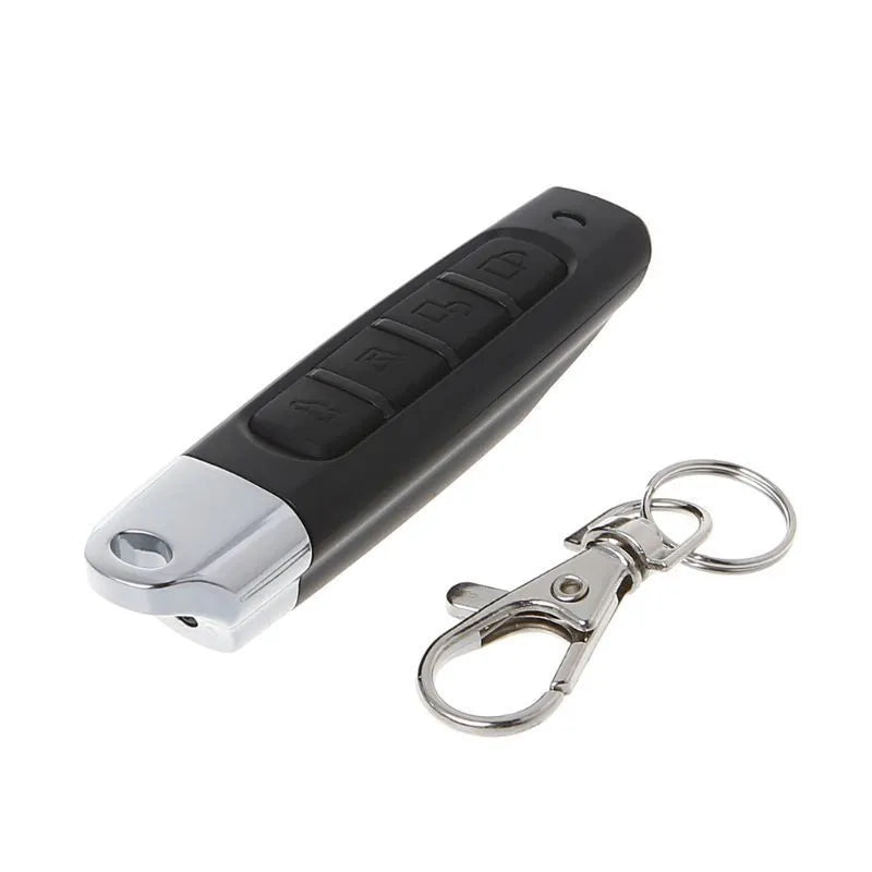 Rolling door remote control transmitter in four colour options showing compact 6.7cm design