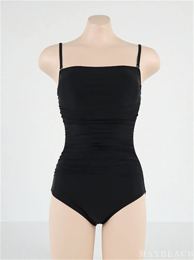 Sling style one-piece swimsuit with belly pleats in solid colour options
