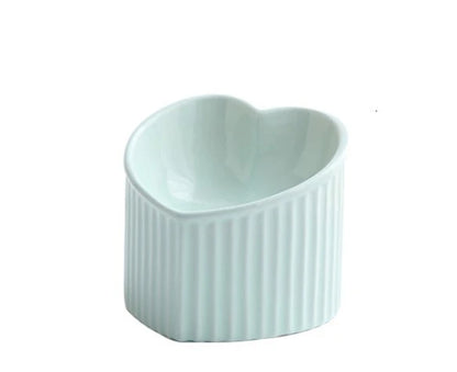 Elevated ceramic pet bowl with tilted design for comfortable and healthy feeding
