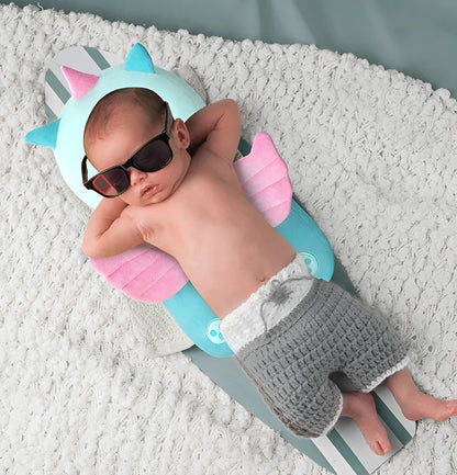 Round baby neck pillow in animal design with elastic straps for anti-fall protection.