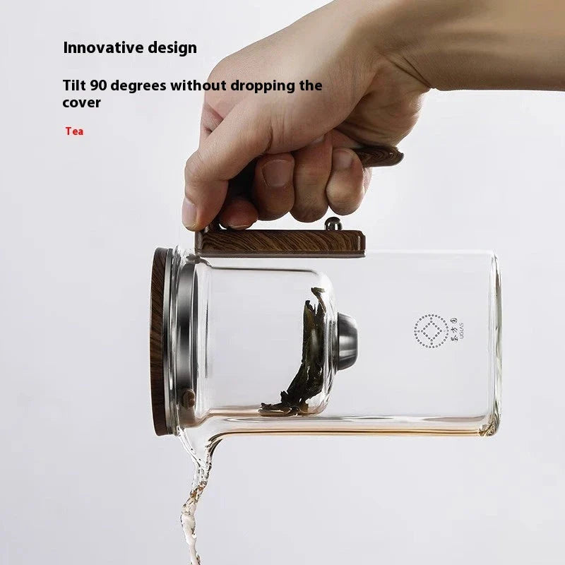 Elegant glass teapot with magnetic water separation filter and wooden handle for brewing and pouring loose leaf tea