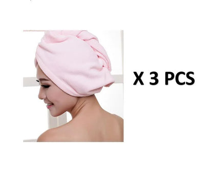 A woman wearing a sky blue microfiber hair dryer cap, with wet hair tucked inside, showing the towel's wrap-around design.