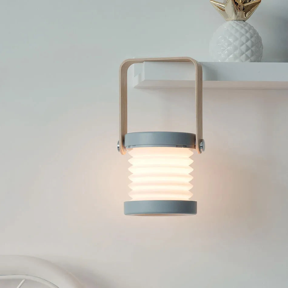 Foldable touch dimmable LED night light showing table lamp and lantern configurations