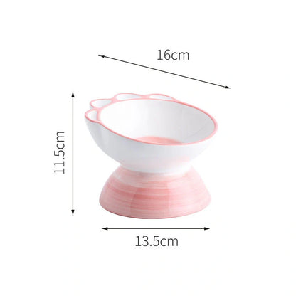 Ceramic pet bowl with cartoon paw design and 15-degree incline for comfortable feeding