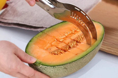 Silver stainless steel melon cutter for slicing watermelon and other large fruits.