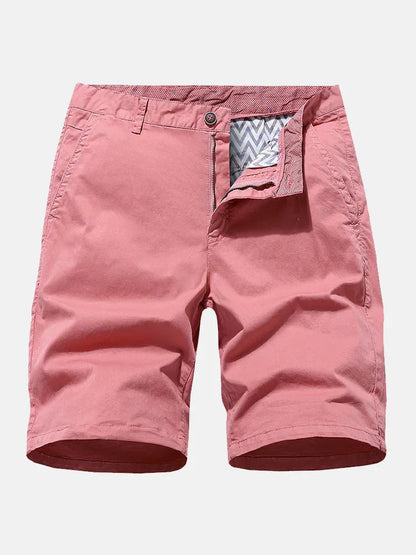 Man wearing blue denim loose-fit casual shorts with an elasticated waist, no belt.