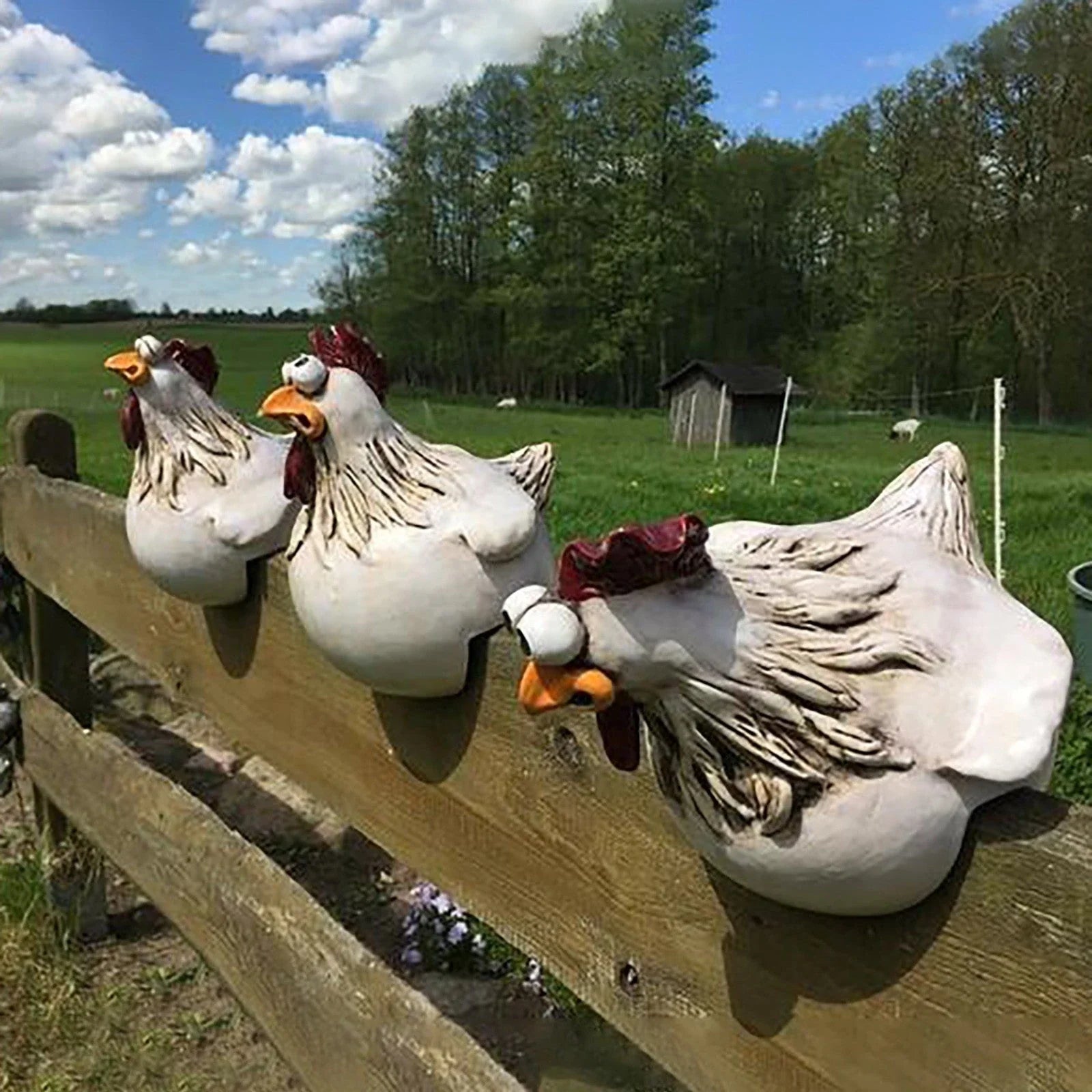Resin chicken garden ornament with vibrant colours and charming design, adding whimsical appeal to outdoor British garden display