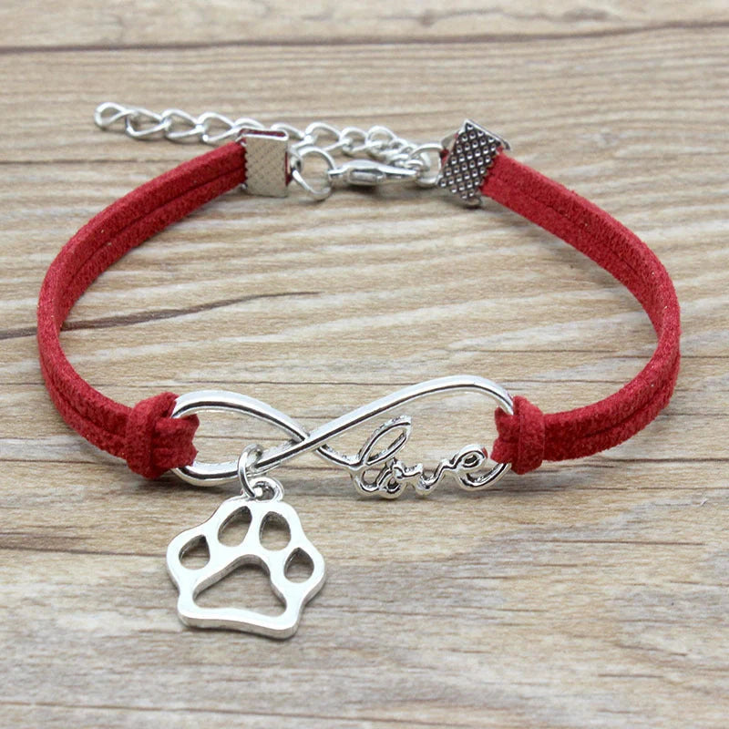 Stylish hand-woven infinite love pet bracelet in various colours, featuring a bow design and made of premium alloy materials