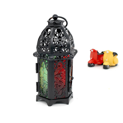 Wrought iron candle holder with 16cm height and 7cm diameter in black finish showing hanging design