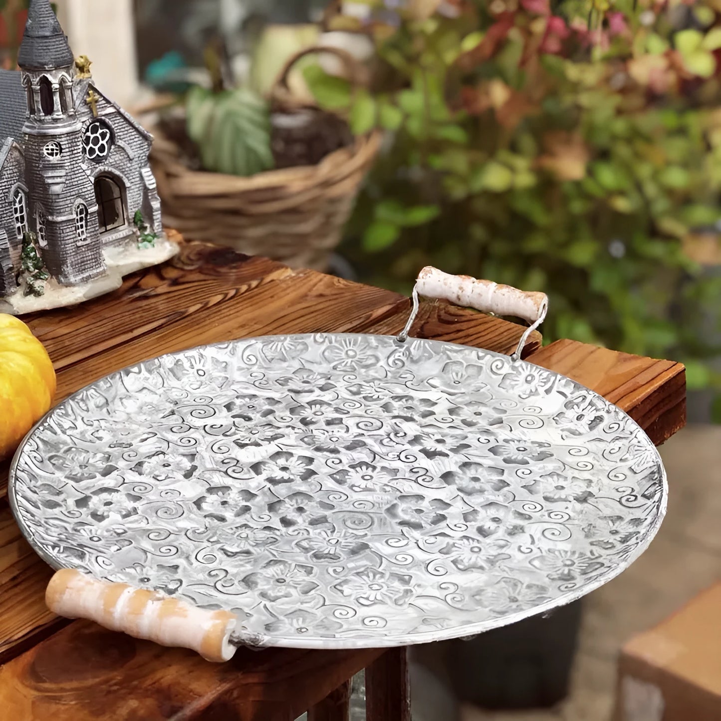 Round wrought iron storage tray in two sizes for organising jewellery or household items.