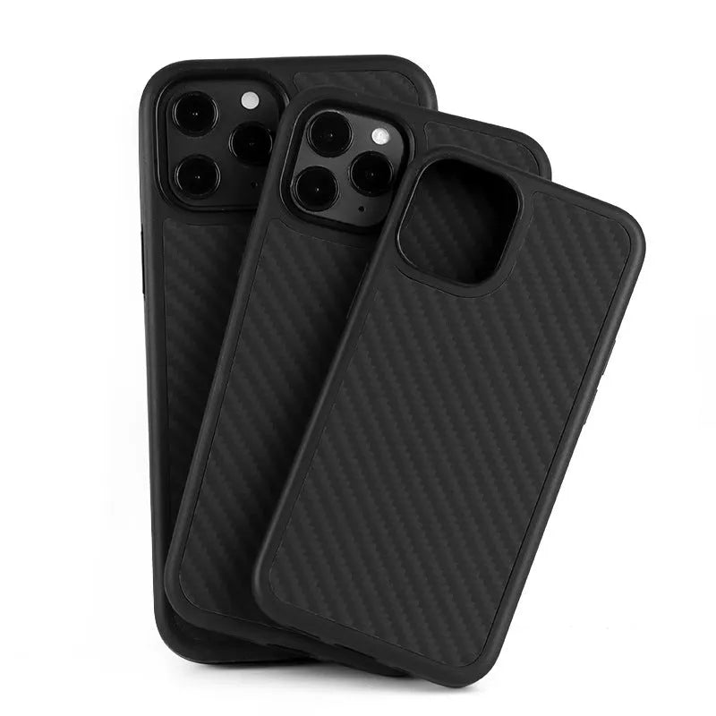 Black solid colour wooden iPhone case with TPU and Kevlar construction on a table.