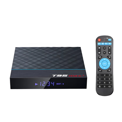 Black T95 Max Plus Android TV Box set-top unit with remote control on a wooden surface.